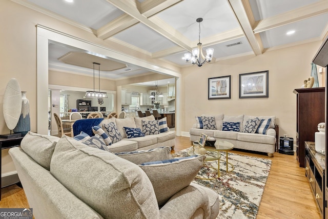 11 Main St, Newnan, GA 30263 - living room with a chandelier, coffered ceiling, beamed ceiling, light wood-type flooring, and crown molding