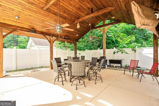 11 Main St, Newnan, GA 30263 - view of patio / terrace featuring a fenced backyard, a ceiling fan, and outdoor dining space