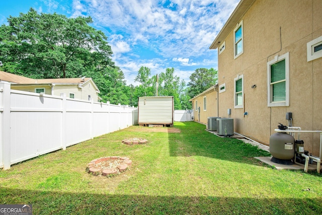 11 Main St, Newnan, GA 30263 - view of yard with central air condition unit, a storage unit, and an outdoor structure