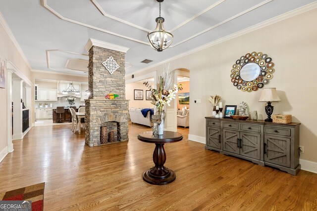 11 Main St, Newnan, GA 30263 - interior space with a chandelier, wood finished floors, arched walkways, ornamental molding, and baseboards