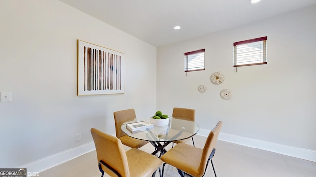 dining room with recessed lighting and baseboards