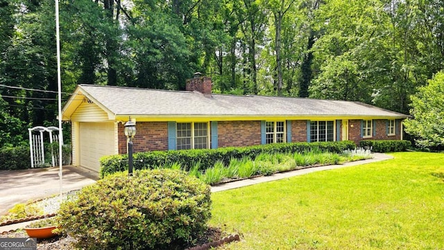 single story home featuring brick siding, a chimney, a front lawn, concrete driveway, and a garage