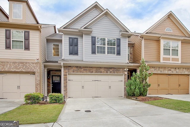 townhome / multi-family property featuring a garage and driveway