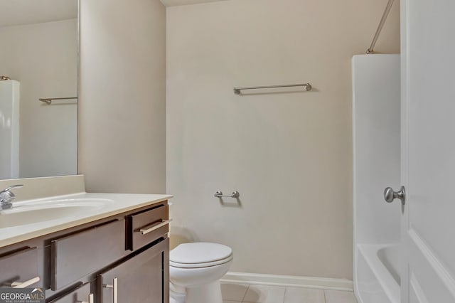 bathroom featuring tile patterned floors, toilet, vanity, and baseboards