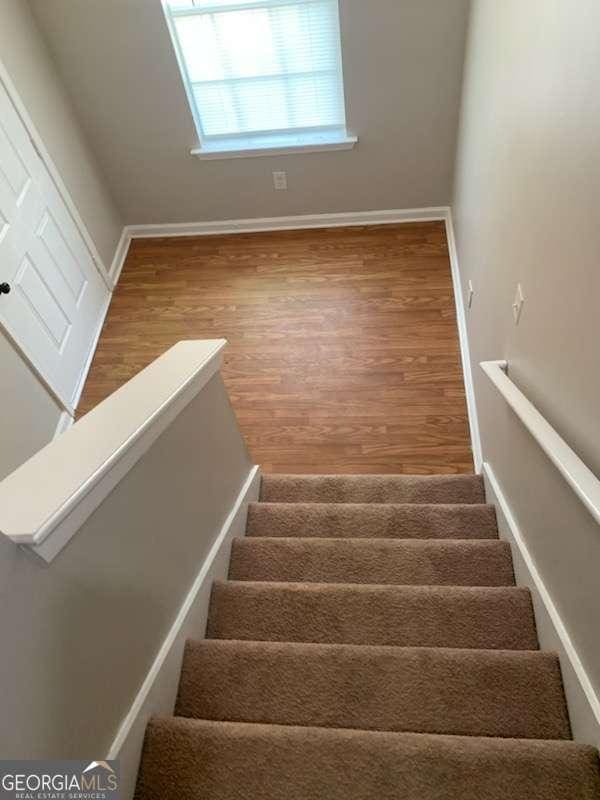 146-148 Arnold Rd, Gray, GA 31032 - staircase featuring wood finished floors and baseboards