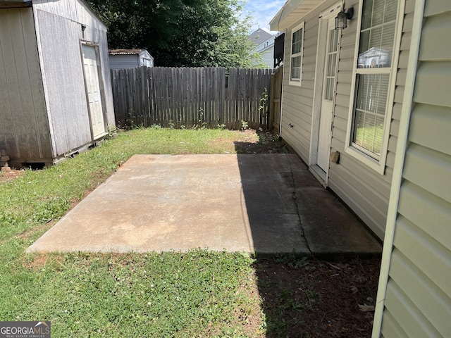view of patio / terrace featuring a fenced backyard and an outdoor structure