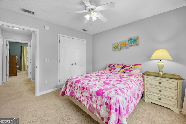 bedroom featuring carpet floors, a closet, baseboards, and ceiling fan