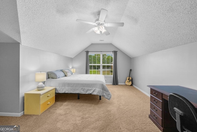 bedroom featuring a textured ceiling, vaulted ceiling, carpet, baseboards, and a ceiling fan