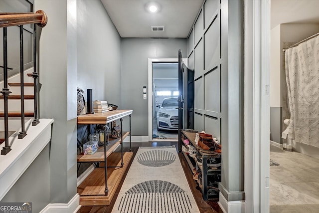 entryway with stairs and baseboards