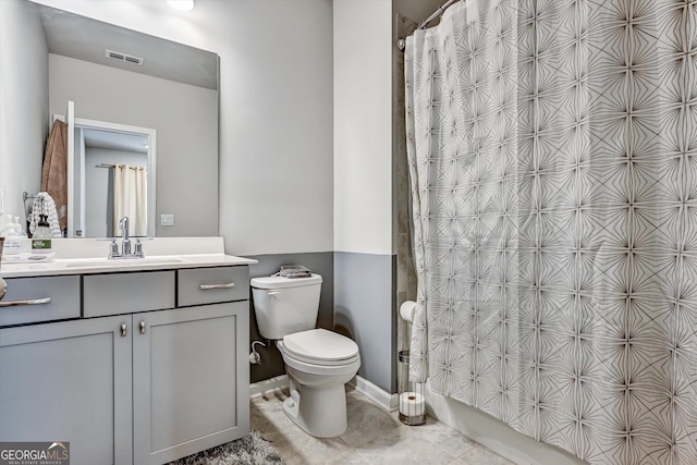 full bathroom with toilet, vanity, curtained shower, and tile patterned floors