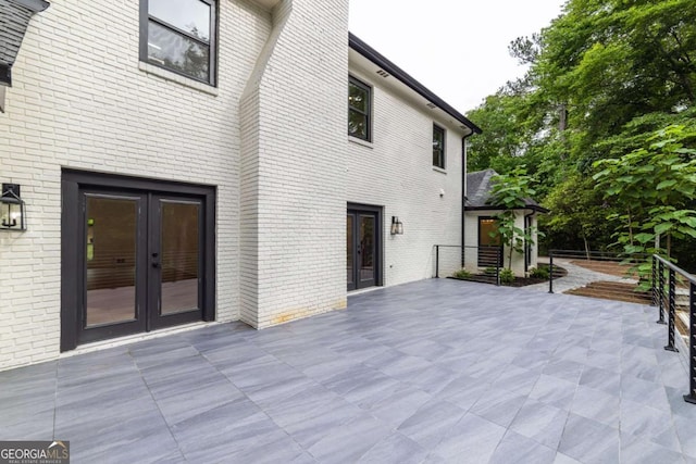 4 Bentley Trace Mnr, Atlanta, GA 30327 - rear view of property with french doors, a patio, and brick siding