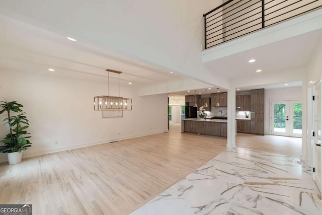 4 Bentley Trace Mnr, Atlanta, GA 30327 - unfurnished living room featuring french doors, recessed lighting, and a chandelier
