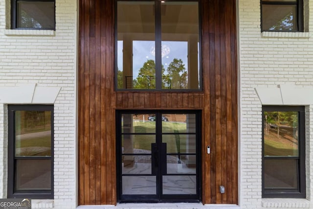 4 Bentley Trace Mnr, Atlanta, GA 30327 - view of exterior entry featuring french doors and brick siding