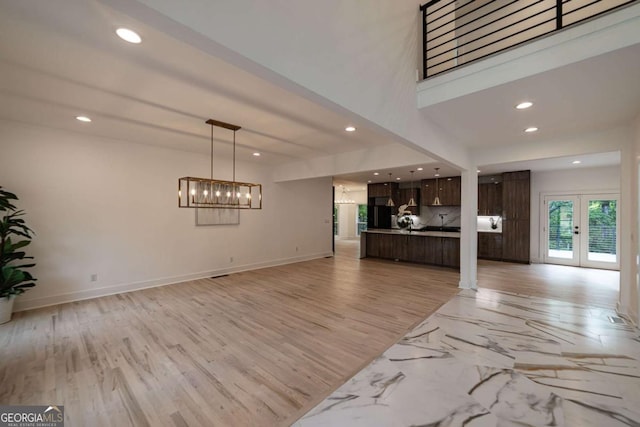4 Bentley Trace Mnr, Atlanta, GA 30327 - unfurnished living room with recessed lighting, a chandelier, and french doors
