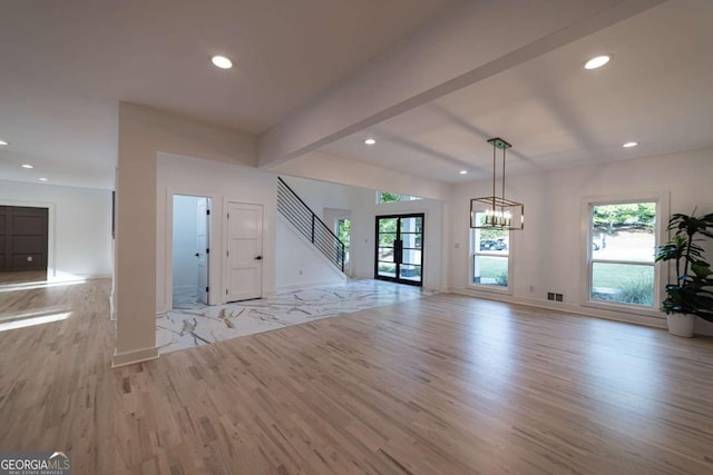 4 Bentley Trace Mnr, Atlanta, GA 30327 - unfurnished living room featuring light wood finished floors, recessed lighting, stairway, beamed ceiling, and a chandelier