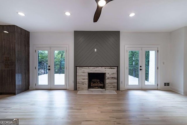 4 Bentley Trace Mnr, Atlanta, GA 30327 - unfurnished living room with french doors, plenty of natural light, light wood finished floors, and recessed lighting