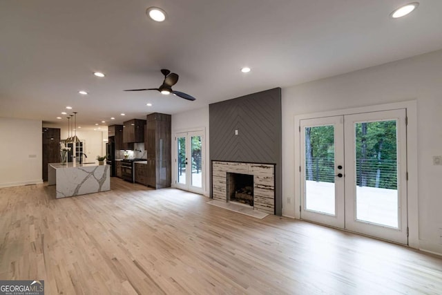 4 Bentley Trace Mnr, Atlanta, GA 30327 - unfurnished living room featuring french doors, healthy amount of natural light, recessed lighting, light wood-style flooring, and ceiling fan