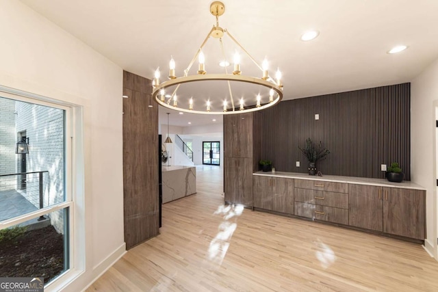 4 Bentley Trace Mnr, Atlanta, GA 30327 - unfurnished dining area with a chandelier and light wood-style floors