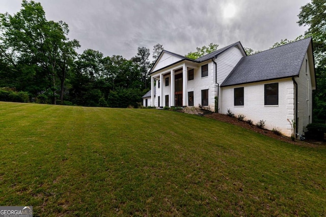 4 Bentley Trace Mnr, Atlanta, GA 30327 - view of front of property featuring a front yard, brick siding, and a shingled roof