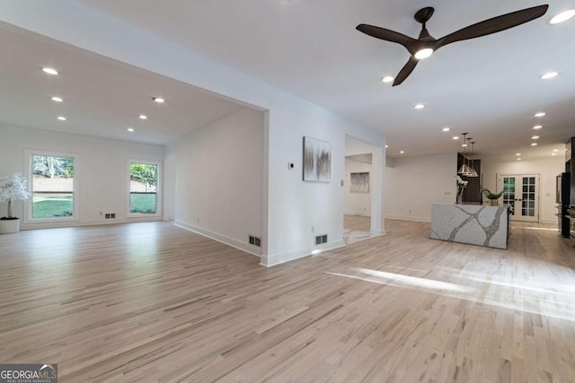 4 Bentley Trace Mnr, Atlanta, GA 30327 - unfurnished living room with light wood-style flooring, a ceiling fan, and recessed lighting