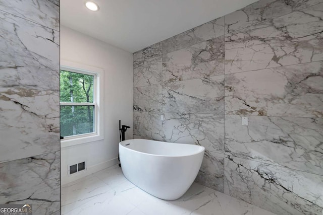 4 Bentley Trace Mnr, Atlanta, GA 30327 - full bath with a freestanding bath, marble tiled flooring, and recessed lighting