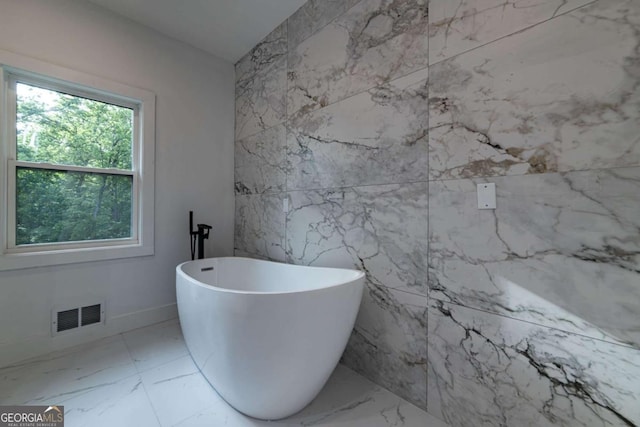4 Bentley Trace Mnr, Atlanta, GA 30327 - full bathroom with a soaking tub, marble finish flooring, and tile walls
