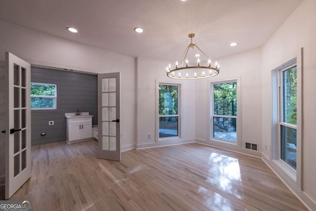 4 Bentley Trace Mnr, Atlanta, GA 30327 - unfurnished dining area with french doors, light wood finished floors, plenty of natural light, and recessed lighting