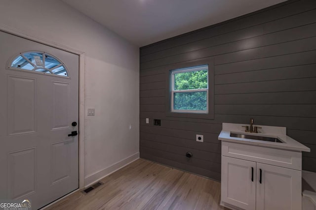 4 Bentley Trace Mnr, Atlanta, GA 30327 - foyer entrance with light wood-type flooring and wood walls
