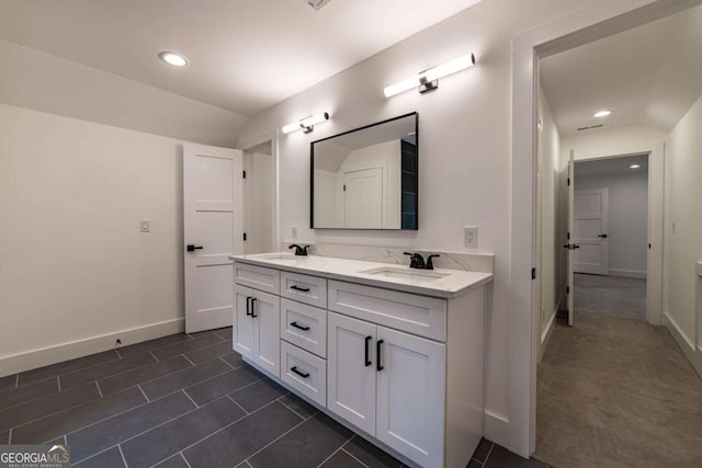 4 Bentley Trace Mnr, Atlanta, GA 30327 - bathroom featuring double vanity, recessed lighting, lofted ceiling, and tile patterned flooring