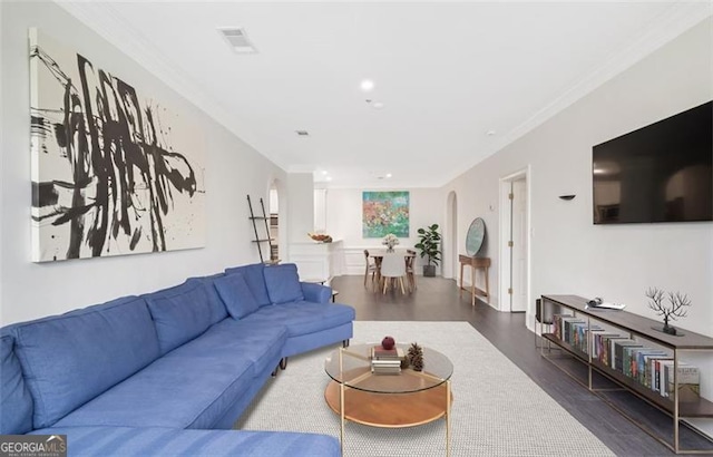 2499 Peachtree Rd NE Unit 503, Atlanta, GA 30305 - living area featuring arched walkways, wood finished floors, ornamental molding, and recessed lighting