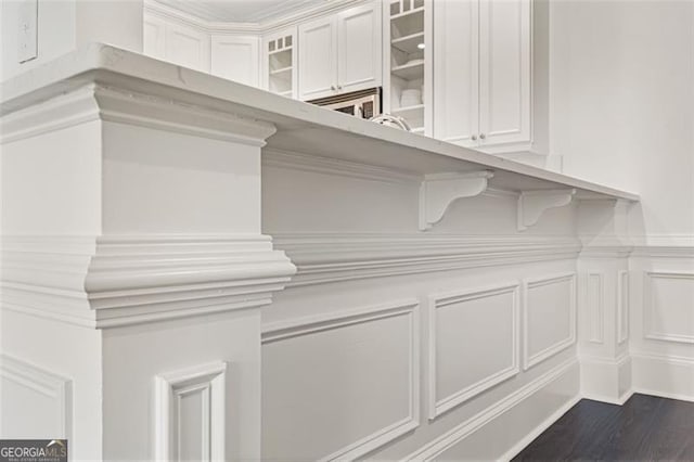 2499 Peachtree Rd NE Unit 503, Atlanta, GA 30305 - detailed view of a decorative wall, wood finished floors, and a wainscoted wall