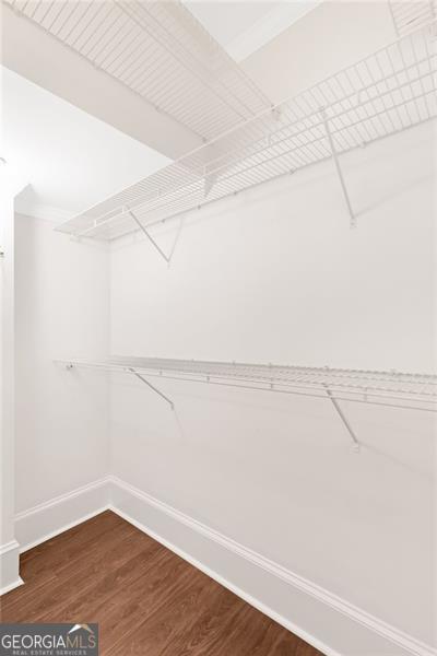2499 Peachtree Rd NE Unit 503, Atlanta, GA 30305 - walk in closet featuring dark wood-type flooring