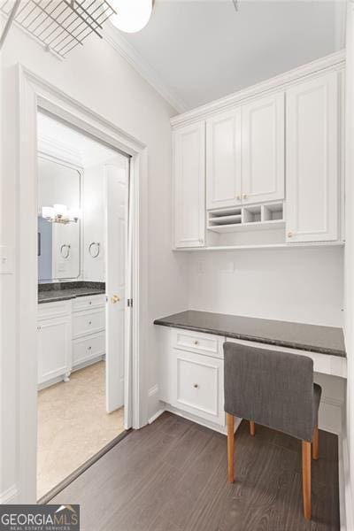 2499 Peachtree Rd NE Unit 503, Atlanta, GA 30305 - unfurnished office featuring dark wood-style floors, crown molding, built in study area, and baseboards