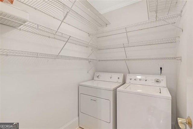 2499 Peachtree Rd NE Unit 503, Atlanta, GA 30305 - laundry room with washer and dryer and baseboards