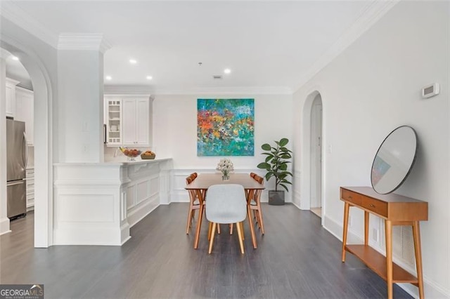 2499 Peachtree Rd NE Unit 503, Atlanta, GA 30305 - dining space featuring arched walkways, ornamental molding, dark wood-style floors, baseboards, and recessed lighting