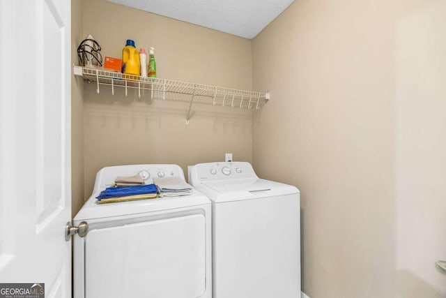 4027 Mount Vernon Dr, Woodstock, GA 30189 - clothes washing area with washing machine and dryer