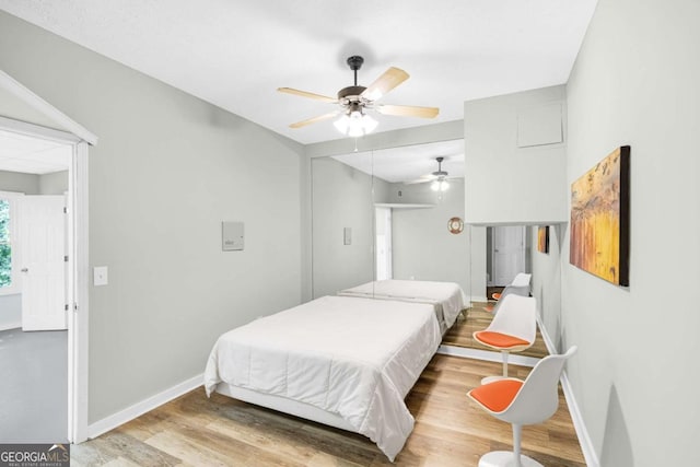 4027 Mount Vernon Dr, Woodstock, GA 30189 - bedroom with baseboards, wood finished floors, a closet, and ceiling fan
