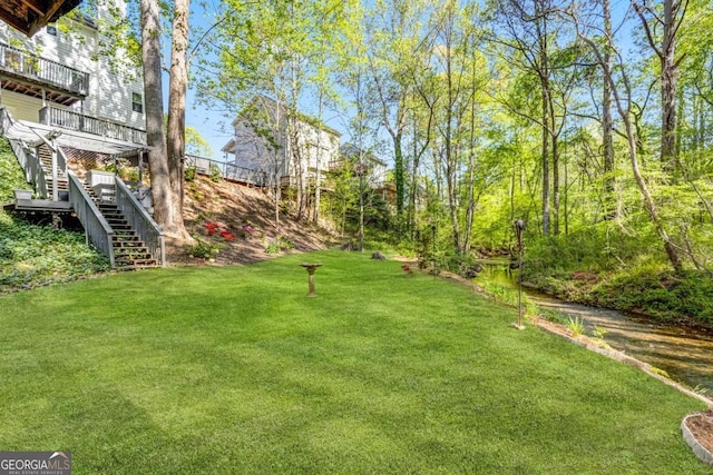4027 Mount Vernon Dr, Woodstock, GA 30189 - view of grassy yard featuring stairway and a wooden deck