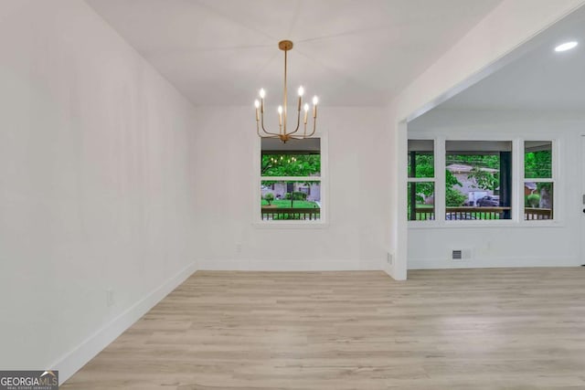 644 Church St NW, Atlanta, GA 30318 - unfurnished dining area featuring a chandelier and light wood finished floors