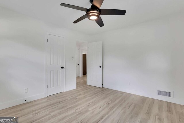 644 Church St NW, Atlanta, GA 30318 - empty room featuring a ceiling fan and light wood-style flooring
