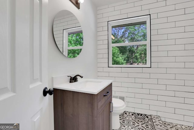 644 Church St NW, Atlanta, GA 30318 - bathroom with vanity, plenty of natural light, and tile patterned flooring