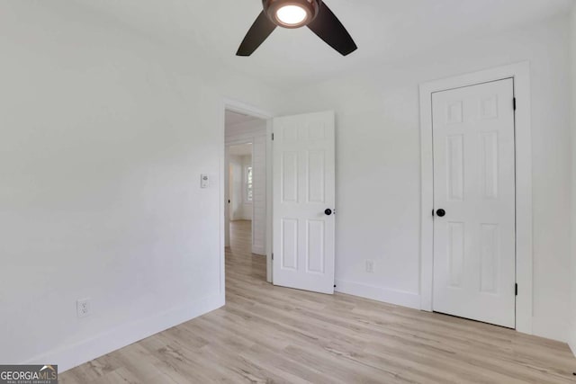 644 Church St NW, Atlanta, GA 30318 - unfurnished bedroom with light wood-style flooring and ceiling fan