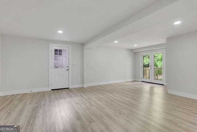 644 Church St NW, Atlanta, GA 30318 - unfurnished living room with recessed lighting and light wood-type flooring