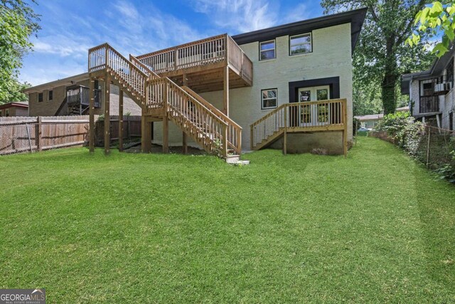 644 Church St NW, Atlanta, GA 30318 - back of house featuring stairway, a fenced backyard, a wooden deck, and brick siding