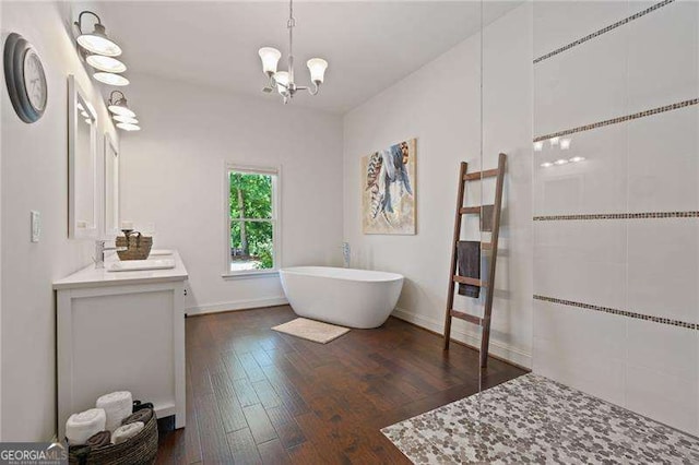 full bathroom with a soaking tub, hardwood / wood-style floors, a chandelier, vanity, and walk in shower