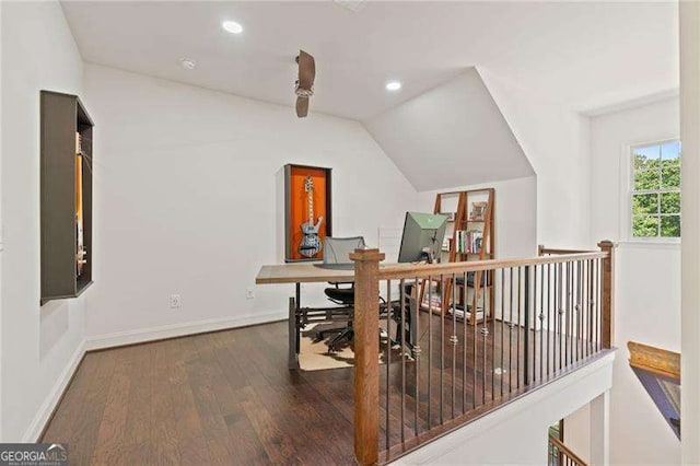 office space featuring vaulted ceiling, wood finished floors, baseboards, and recessed lighting