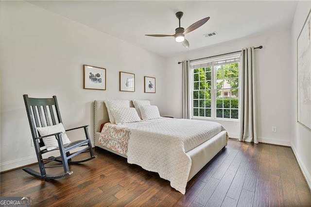 bedroom featuring dark wood finished floors, baseboards, and ceiling fan