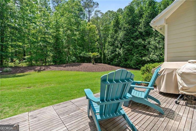 wooden deck with a lawn