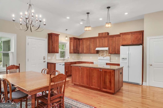 220 Candleberry Way, Guyton, GA 31312 - kitchen with white appliances, under cabinet range hood, a sink, a kitchen island, and light wood finished floors
