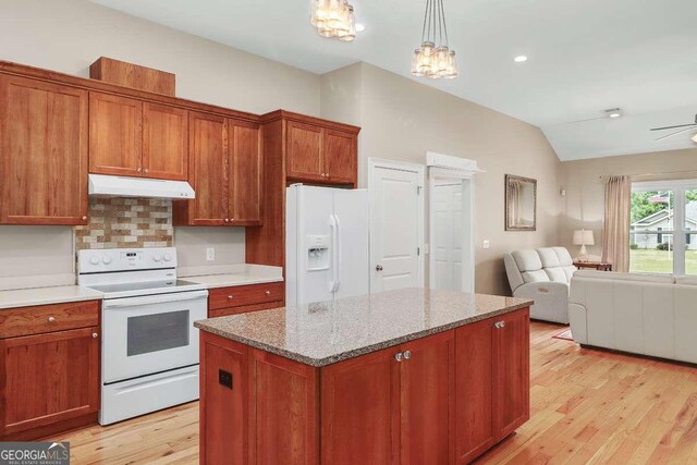 220 Candleberry Way, Guyton, GA 31312 - kitchen with white appliances, under cabinet range hood, open floor plan, lofted ceiling, and light wood-style flooring